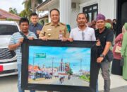 Lukisan Sudut Kota Karya Ketua PD IWO Tebo Dikoleksi Pj Bupati